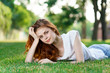 © SHOTPRIME STUDIO - woman lies on green grass, park