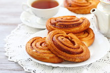 Baked Sweet Cinnamon Rolls With Cup Of Tea