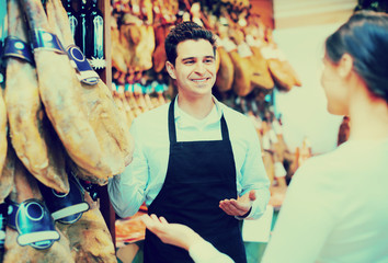 Wall Mural - Female customer buying Spanish jamon