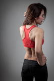 Fototapeta  - Back of Asian strong healthy  girl  with muscular body