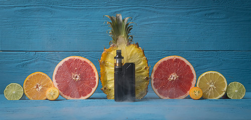 black vaporizer surrounded by citrus