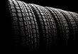 new winter tires in a row. Black and white photo with vignette