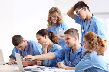 Canvas Print - Group of medical students having lecture indoors