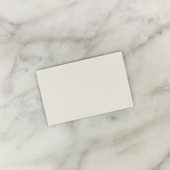 Wall Mural - Blank business card on white marble texture