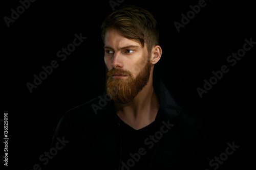 Cuadros en Lienzo Closeup portrait of bearded handsome man in a pensive mood looki