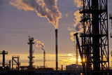 Fototapeta Miasto - Oil Industry Refinery factory at Sunset, Petroleum, petrochemical plant, smoke comes out of  big chimneys after processing and combustion of oil