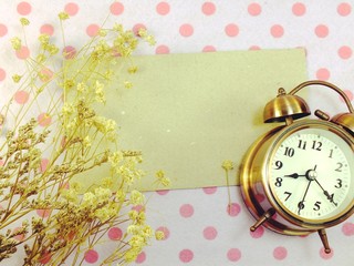 clock with space backgroun with dried flower decorate