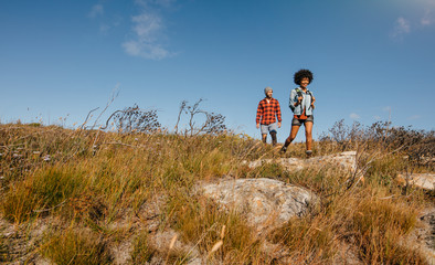 Wall Mural - couple hiking in countryside