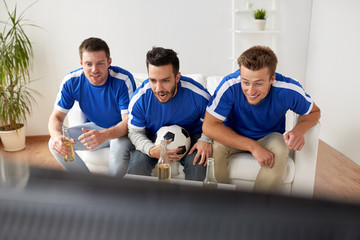 Wall Mural - friends or football fans watching soccer at home