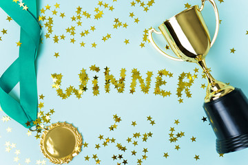 Wall Mural - gold medal and cup on blue background