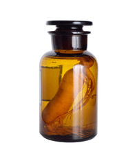 Wall Mural - Ginseng root in the pharmaceutical bottle. Isolated.