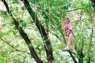 Wall Mural - adventure climbing high wire park - hiking in the rope park girl