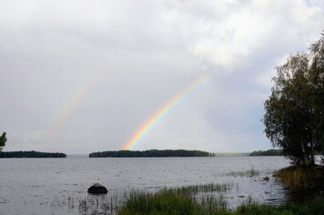 Rainbow over calm water North of the lake.