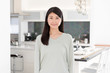 © taka - portrait of attractive asian woman in the kitchen