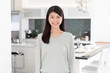 © taka - portrait of attractive asian woman in the kitchen