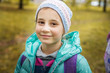 © Svitlana - Portrait of a girl of school age on the background of autumn Park.