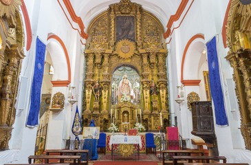 Wall Mural - CORDOBA, SPAIN - MAY 26, 2015: The carved baroque main altar in Church Eremita de Nuestra Senora del Socorro by Alfonso Gomes de Sandoval from 17. cent.