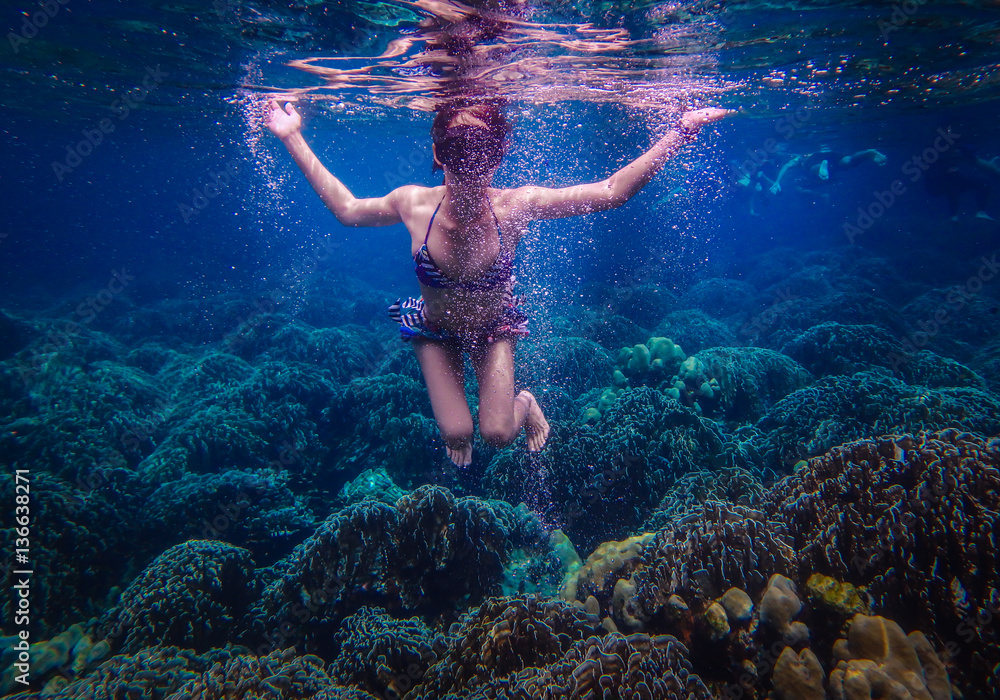 Underwater Photo of a Woman Diving , girl wearing bikini in action dive ...