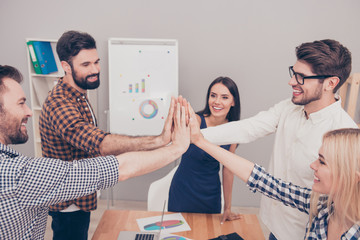 Poster - Happy smilling colleagues giving high five to each other