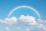 Fototapeta Tęcza - beautiful classic rainbow across in the blue sky after the rain.
