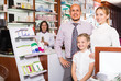 © JackF - Family with a kid in pharmacy .