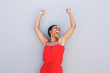 Cheerful Young Black Woman With Arms Raised