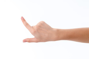 Wall Mural - female hand showing the gesture with raised forefinger up isolated on white background