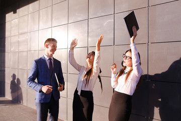 three young attractive educated young businessman talking, smili