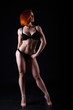 © Olena_Molchanova - Young strong sexy woman showing her muscles.