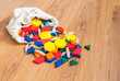 Wooden colored blocks poured out of bag Shallow DOF