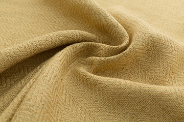 yellow background luxury cloth or wavy folds of grunge silk texture satin velvet