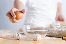 Close Up Shot Hand Of Woman Holding Egg For Braking Shell With G
