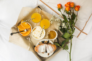 Romantic breakfast with love, croissants, coffee, orange juice