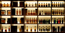 Various Alcohol Bottles In A Bar, Back Light, Logos Removed