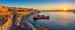 © zgphotography - Valletta, Malta - Panoramic skyline view of Valletta and the Grand Harbor with beautiful sunrise, ships and clear blue sky
