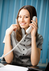 Wall Mural - Portrait of happy smiling businesswoman with phone and document