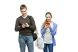 © svetography - Teen boy and girl standing with mobile phones