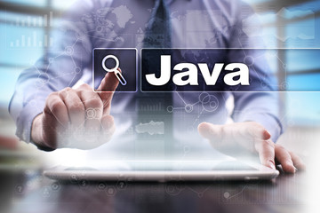 businessman using tablet pc and selecting java .