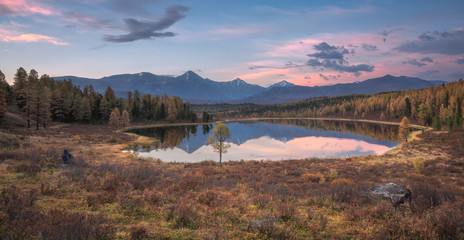 Wall Mural - Mirror Surface Lake Early Sunset Wide Angle Autumn Landscape With Mountain Range On Background