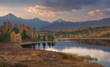 Mirror Surface Lake Beautiful Evening Autumn Landscape With Mountain Range On Background