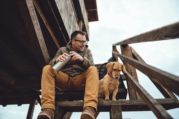 Hiker and dog resting