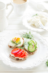 Sticker - Appetizer sandwiches and cheese and vegetables.