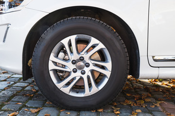 Wall Mural - Closeup photo of white modern car wheel