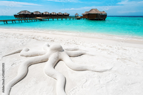 Concept octopus, sand sculpture at tropical beach island resort Poster