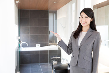 Wall Mural - asian businesswoman showing bathroom