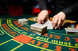 © ruslanseradziuk - the dealer deals the cards in a casino
