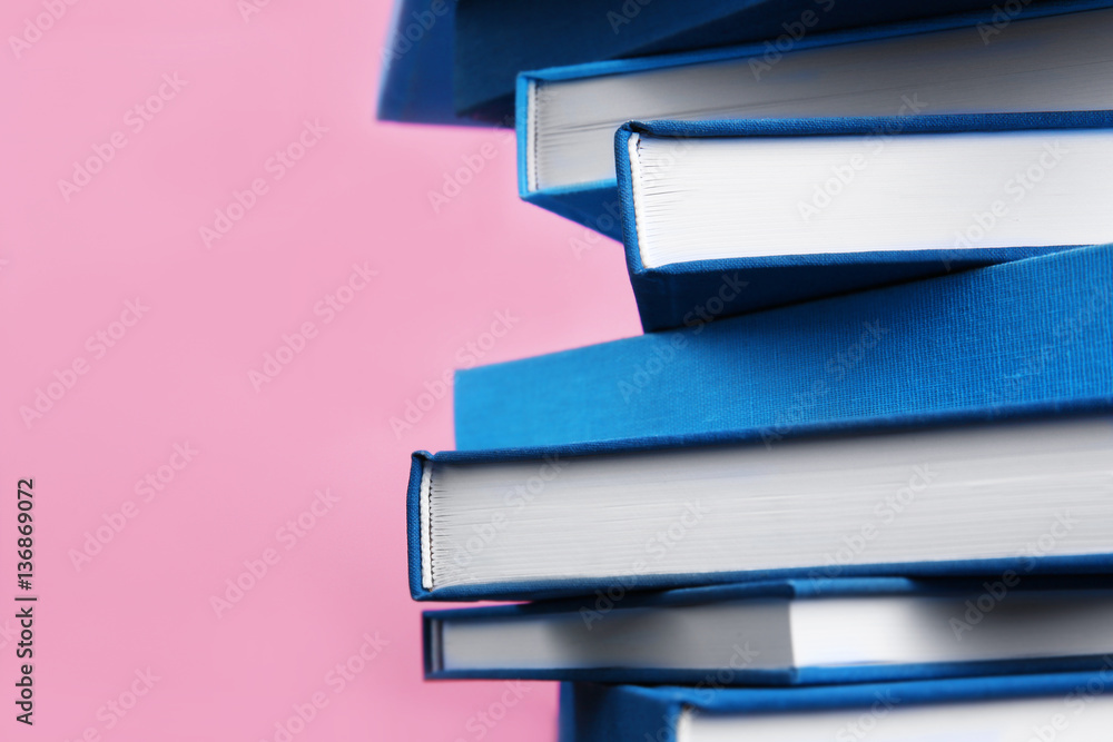 Blue books on pink background