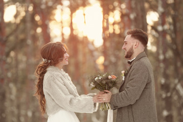 Wall Mural - Happy wedding couple outdoors on winter day