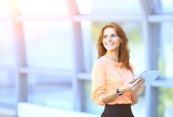 Business woman working on a digital tablet in the office, on the one hand a place for text and Publicity