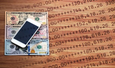 Wall Mural - Mobile phone on dollar cash banknote and statement, digital money and finance concept, double exposure